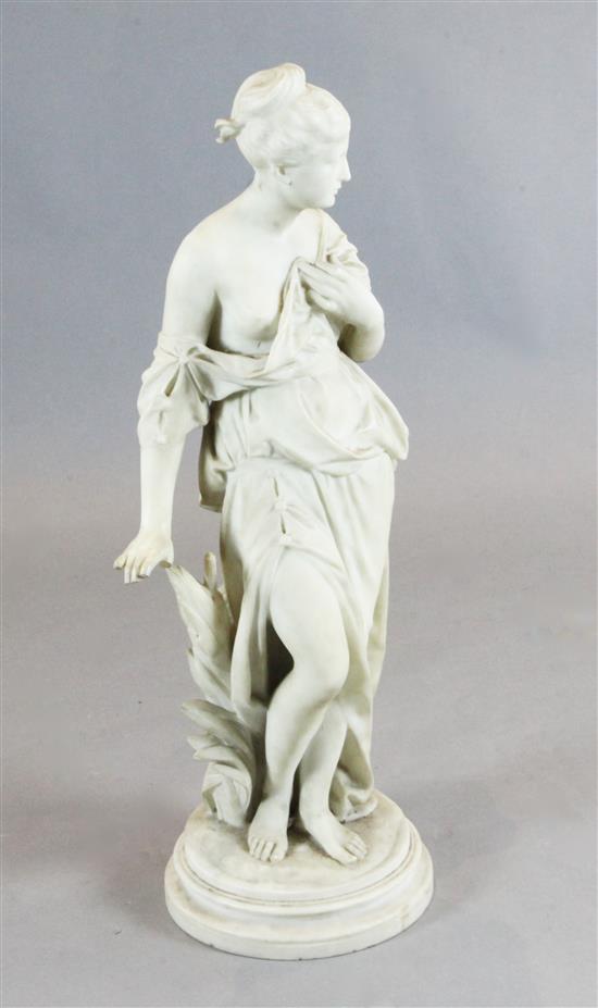 Emile-André Boisseau (1842-1923). A carved white marble figure of a classical maiden standing beside bulrushes, 36in.